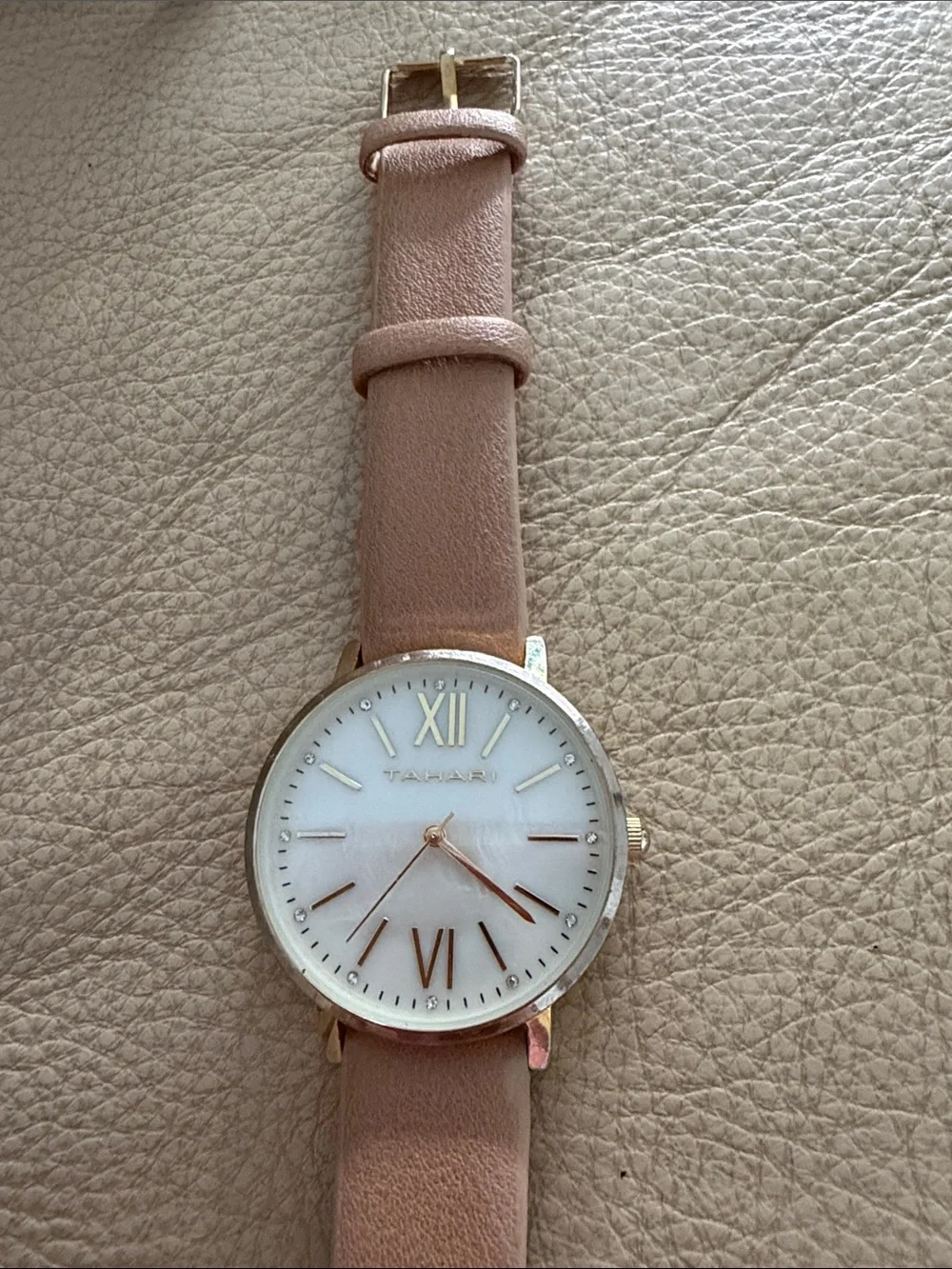 Tahari Blush Leather Strap Watch with Rose Gold Accents needs battery
